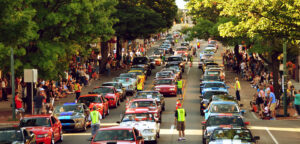 Ford Mustangs line up in the street in Carlisle, PA during a car show.