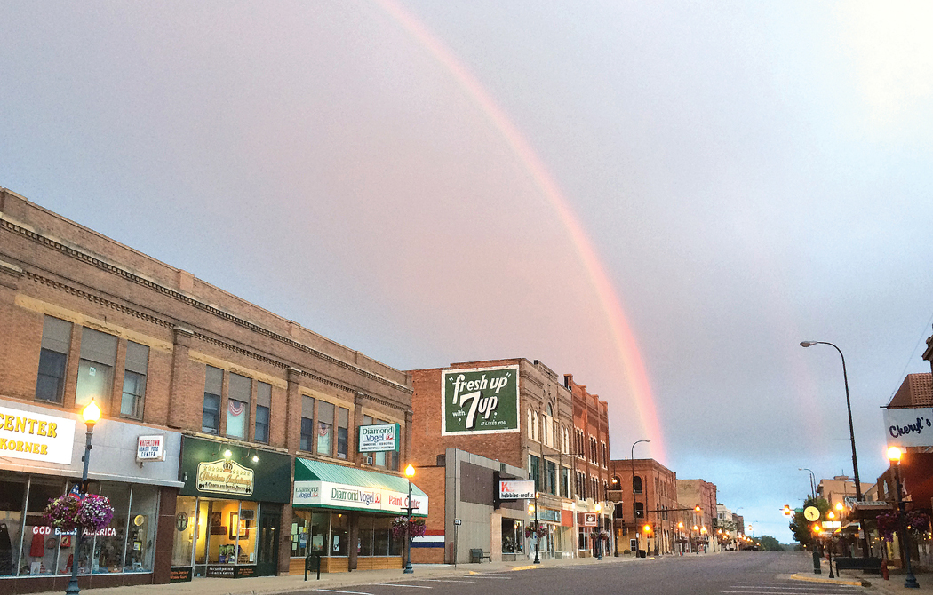 A rainbow shines over the top of Uptown Watertown, SD.