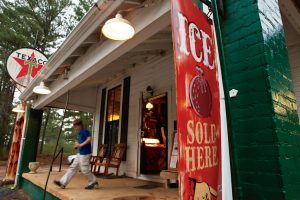A boy walks out of the Causeyville General Store, an old southern store in Meridian, MS.