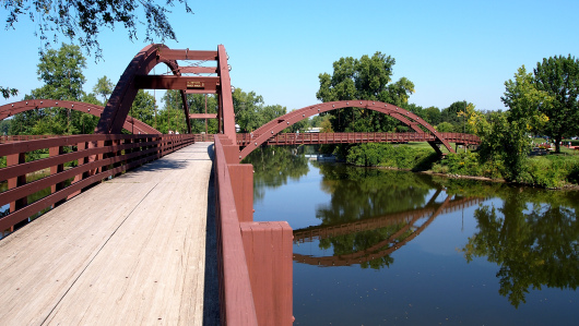 The view of three bridges that meet over a river in Midland, MI.
