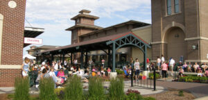 People mill around the Greenway Station Shopping Center in Middleton, WI