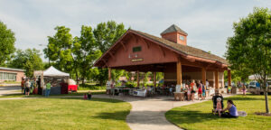People gather around the Hometown Junction Farmers Market in Verona