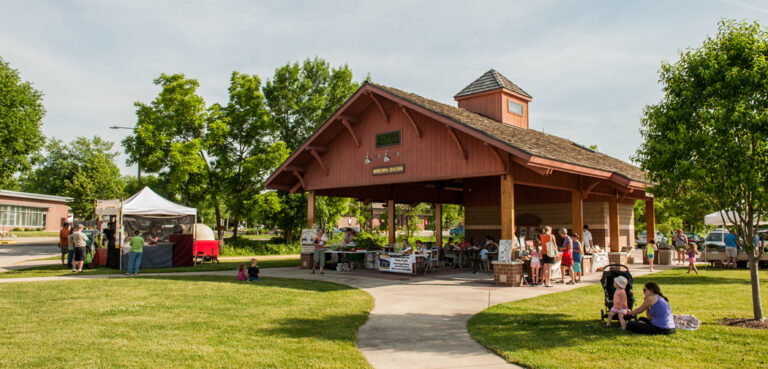 People gather around the Hometown Junction Farmers Market in Verona