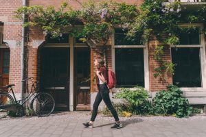 woman walking through a new city