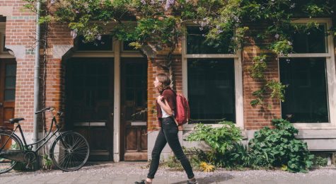 woman walking through a new city