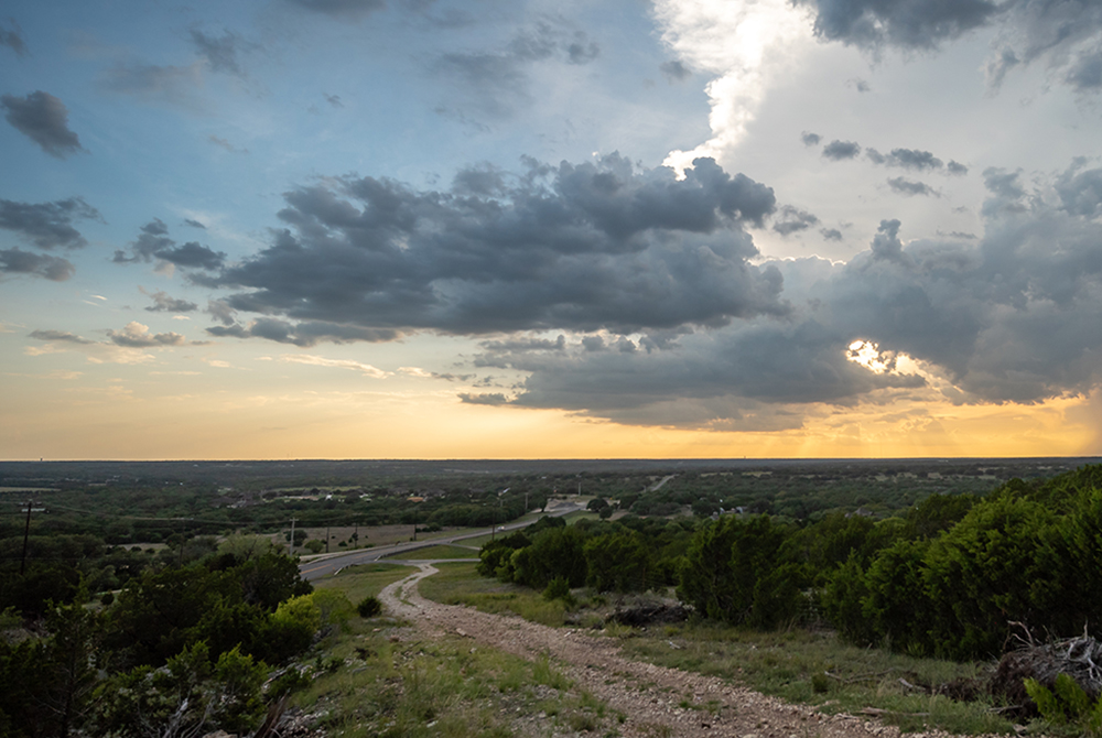 Wide Angle View of the Texas Hill. Country with Large Clouds in the Sky.