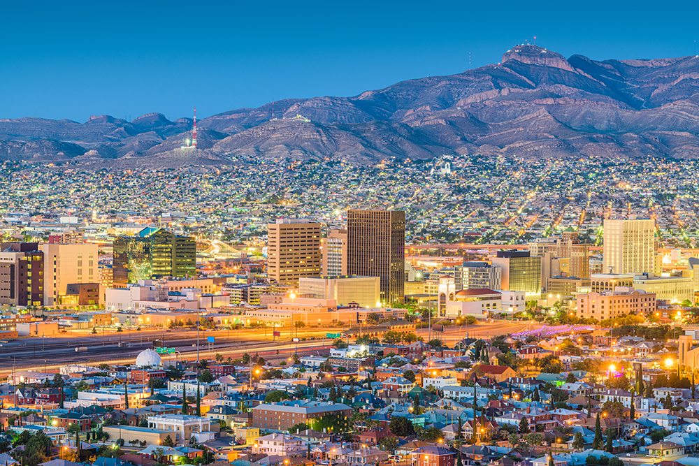 El Paso, Texas, USA downtown city skyline at dusk with Juarez, Mexico in the distance.
