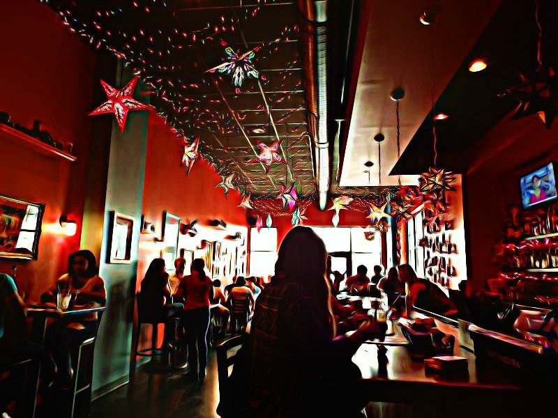 Patrons enjoy the confines of a dark restaurant in Carborro, NC.
