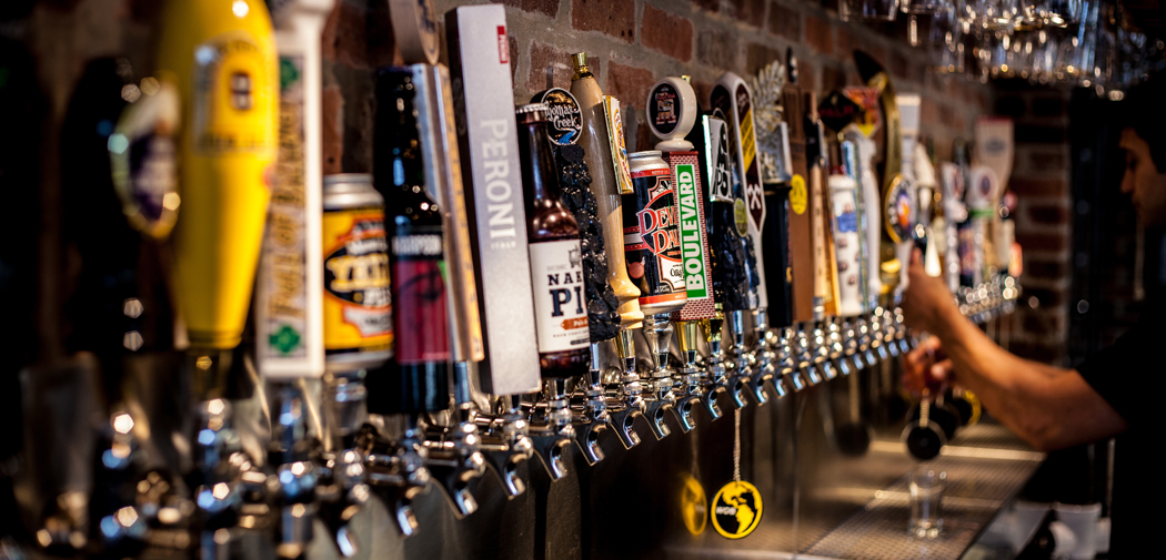A line up of beer taps at World of Beer a craft beer tavern in Birmingham, AL