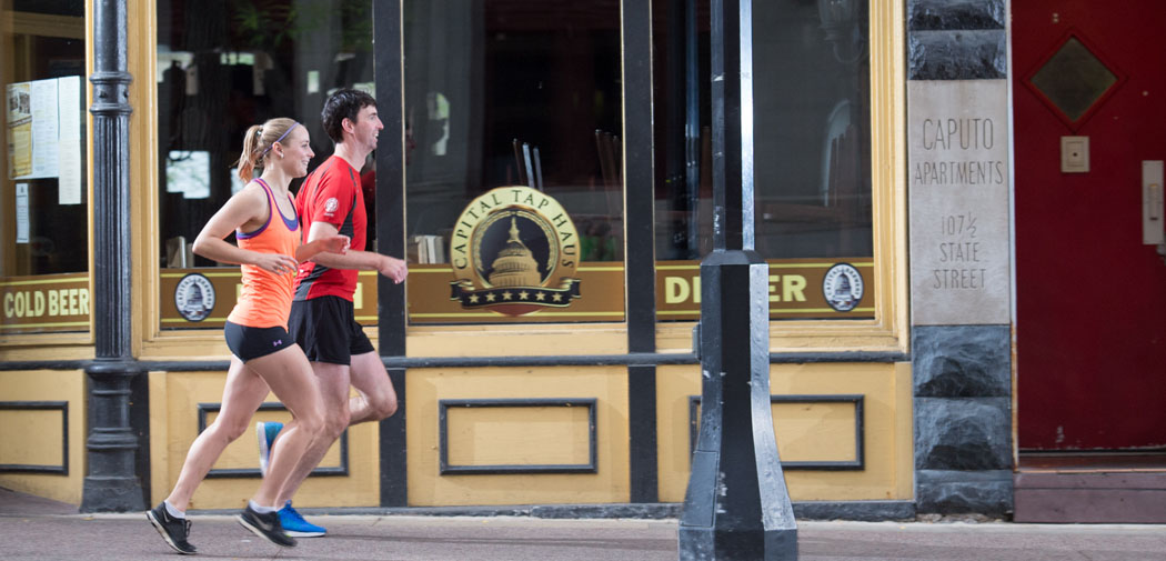 Runners jog through the streets of Madison, Wisconsin.