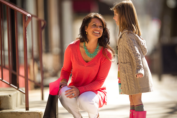 A mom and daughter talk in downtown Naperville.