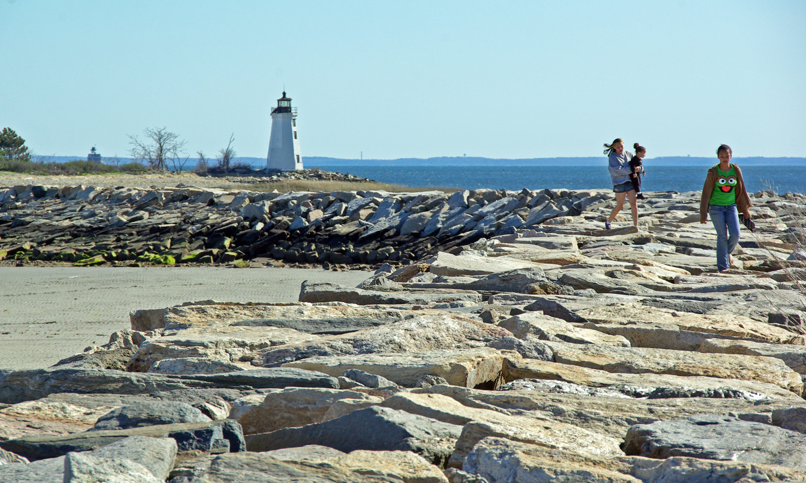 Visitors enjoy the Fayerweather Island Light in Bridgeport, Connecticut.