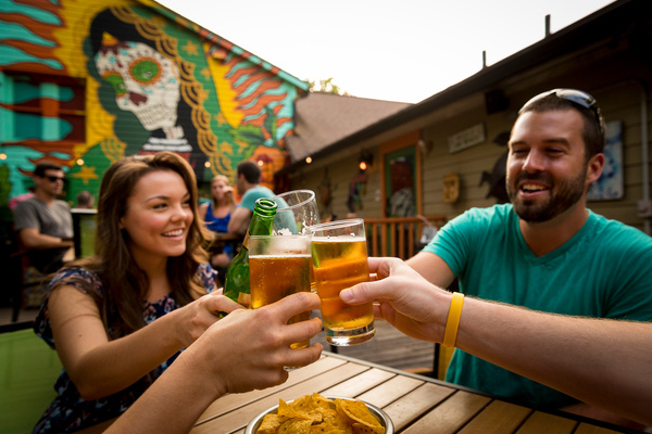 Friends toast at a bar in Jacksonville, FL