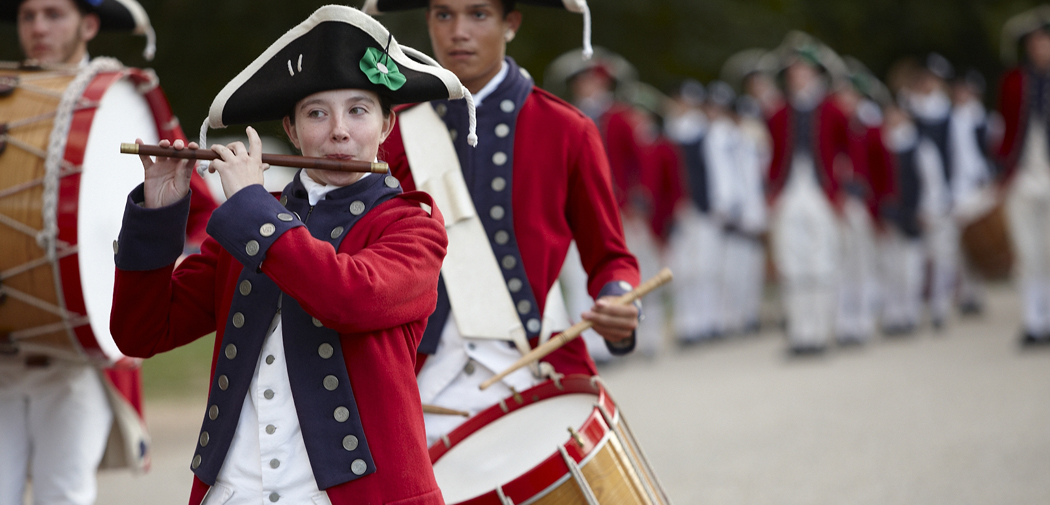 A group of young fifers and drummers march and perform throughout Historic Yorktown in Williamsburg, Virginia.