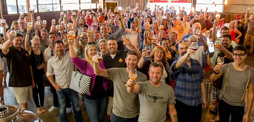 Patrons and employees of Wild Heaven Craft Beers celebrate the release of a new brew.