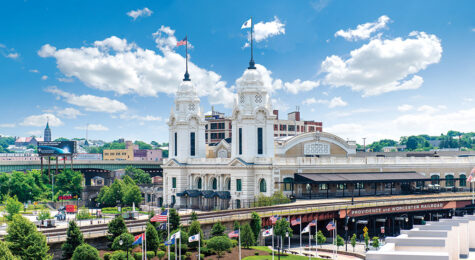 Exterior shot of a large white building in downtown Worcester, MA