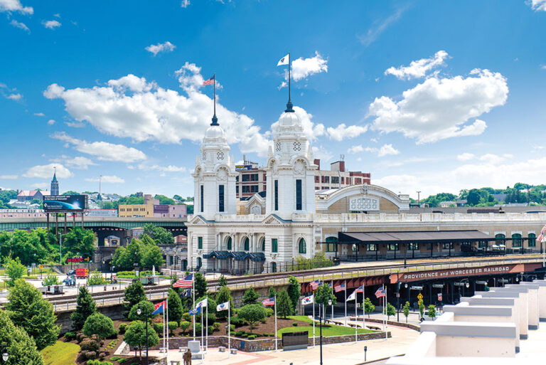 Exterior shot of a large white building in downtown Worcester, MA