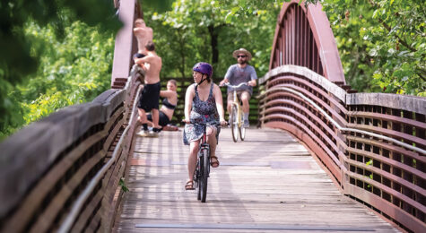 cyclists riding on greenway