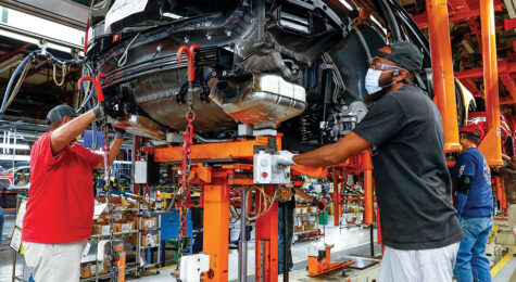 Men work on the assembly line for General Motors, which is part of the Nashville area's state of innovation.