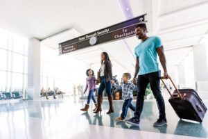 Family walking through airport