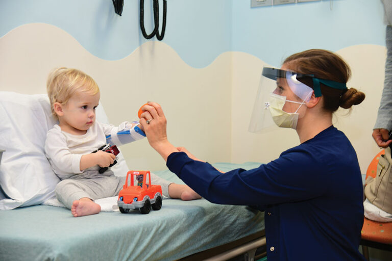 nurse works with young patient