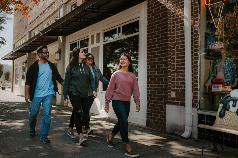 family walking downtown