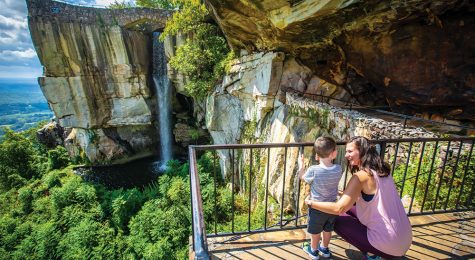 mother and son looking at waterfall