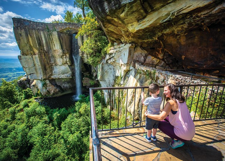 mother and son looking at waterfall