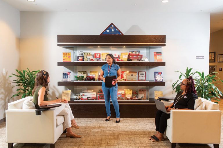 Colleagues have a discussion at Tractor Supply Co.’s Store Support Center in Brentwood