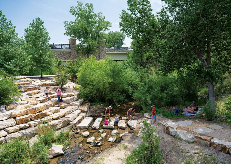people playing near creek in Castle Rock