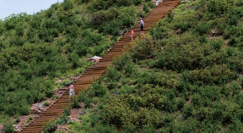 people walk the numerous steps of Challenge Hill