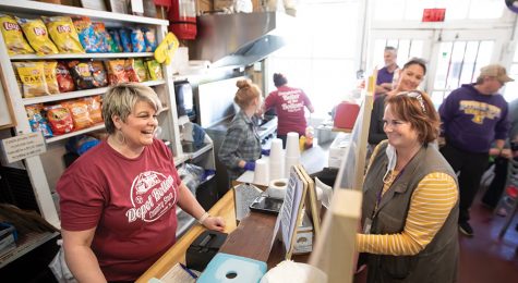 woman purchasing item at country store