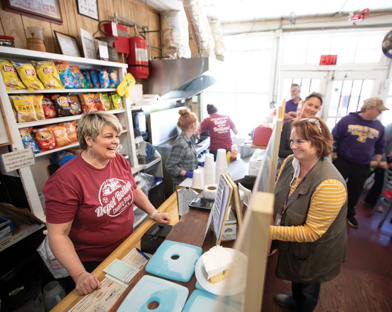 woman purchasing item at country store