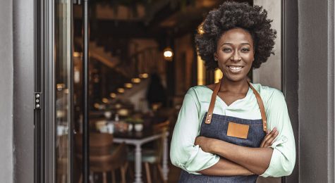 African woman in apron small business owner