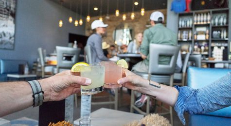 Couple clinks together craft spirit drink the Rising Sun from Marble Distilling Co. in Colorado