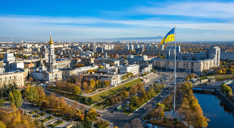 Aerial view to highest ukrainian flag in flagpole on embankment of Lopan river in Kharkiv, Ukraine