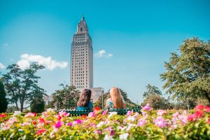 Two girls sitting in the garden at the capitol building during a weekend getaway in Baton Rouge, LA