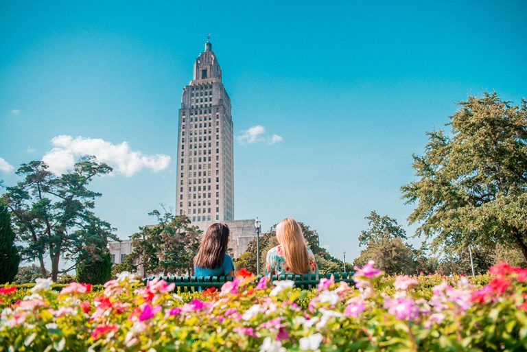 Two girls sitting in the garden at the capitol building during a weekend getaway in Baton Rouge, LA