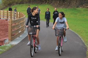 Sisters Jade, left, and Jazlyn Diamond bike along the Cardinal Greenway in Richmond.
