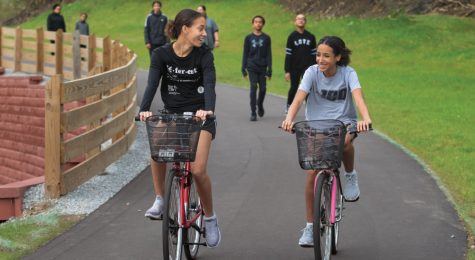 Sisters Jade, left, and Jazlyn Diamond bike along the Cardinal Greenway in Richmond.