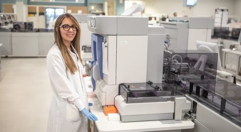 Employees provide quality control along the automation line at DaVita Labs new advanced automation lab in DeLand, Florida (part of the Greater Daytona Region).