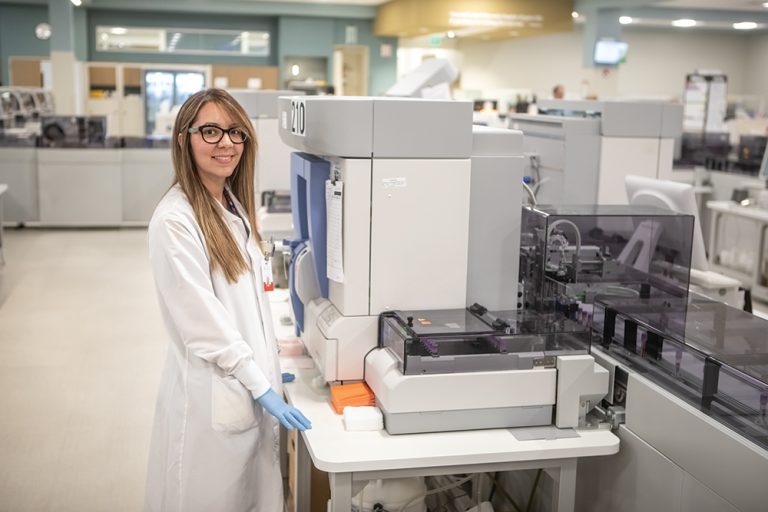 Employees provide quality control along the automation line at DaVita Labs new advanced automation lab in DeLand, Florida (part of the Greater Daytona Region).