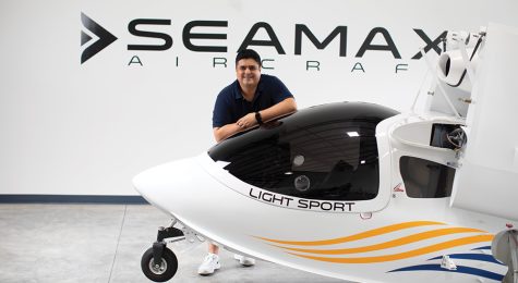 Shalom Confessor, is Executive Director of the SEAMAX, LLC USA Headquarters in Daytona Beach, Florida (part of the Greater Daytona Region). He is standing behind a SEAMAX Light Sport Aircraft. ©Journal Communications/Jeff Adkins