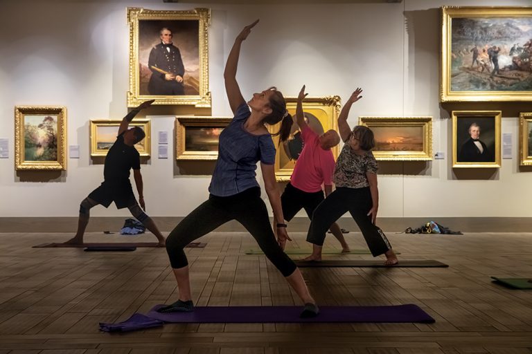 People participate in an evening yoga inside the art gallery at the Museum of Arts and Sciences in Daytona (Greater Daytona Region). ©Journal Communications/Nathan Lambrecht