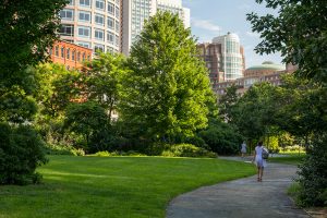 People walking along the Rose Kennedy Greenway in Boston, MA.
