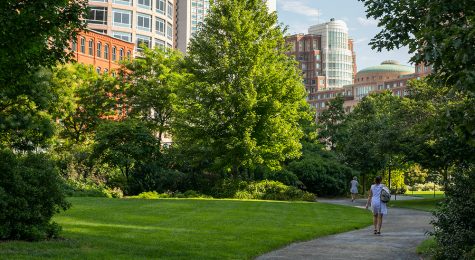 People walking along the Rose Kennedy Greenway in Boston, MA.