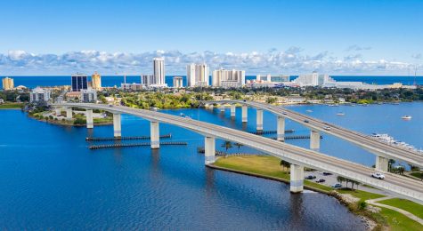 Drone angle view of Daytona Beach skyline and bridges over the intracoastal waterway.