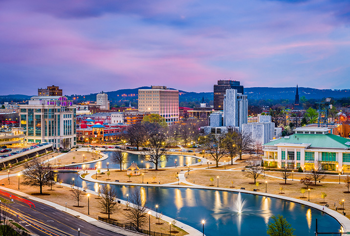 Huntsville, Alabama, USA park and downtown cityscape at twilight.