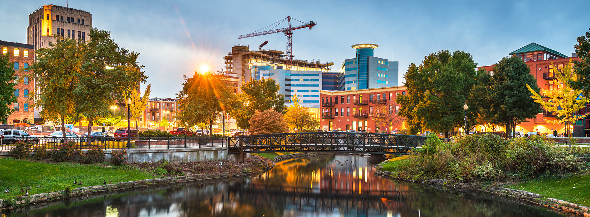 Kalamazoo, Michigan, USA downtown cityscape and park at dusk.