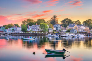 Sunset over boats docked in the water in Portsmouth, New Hampshire.